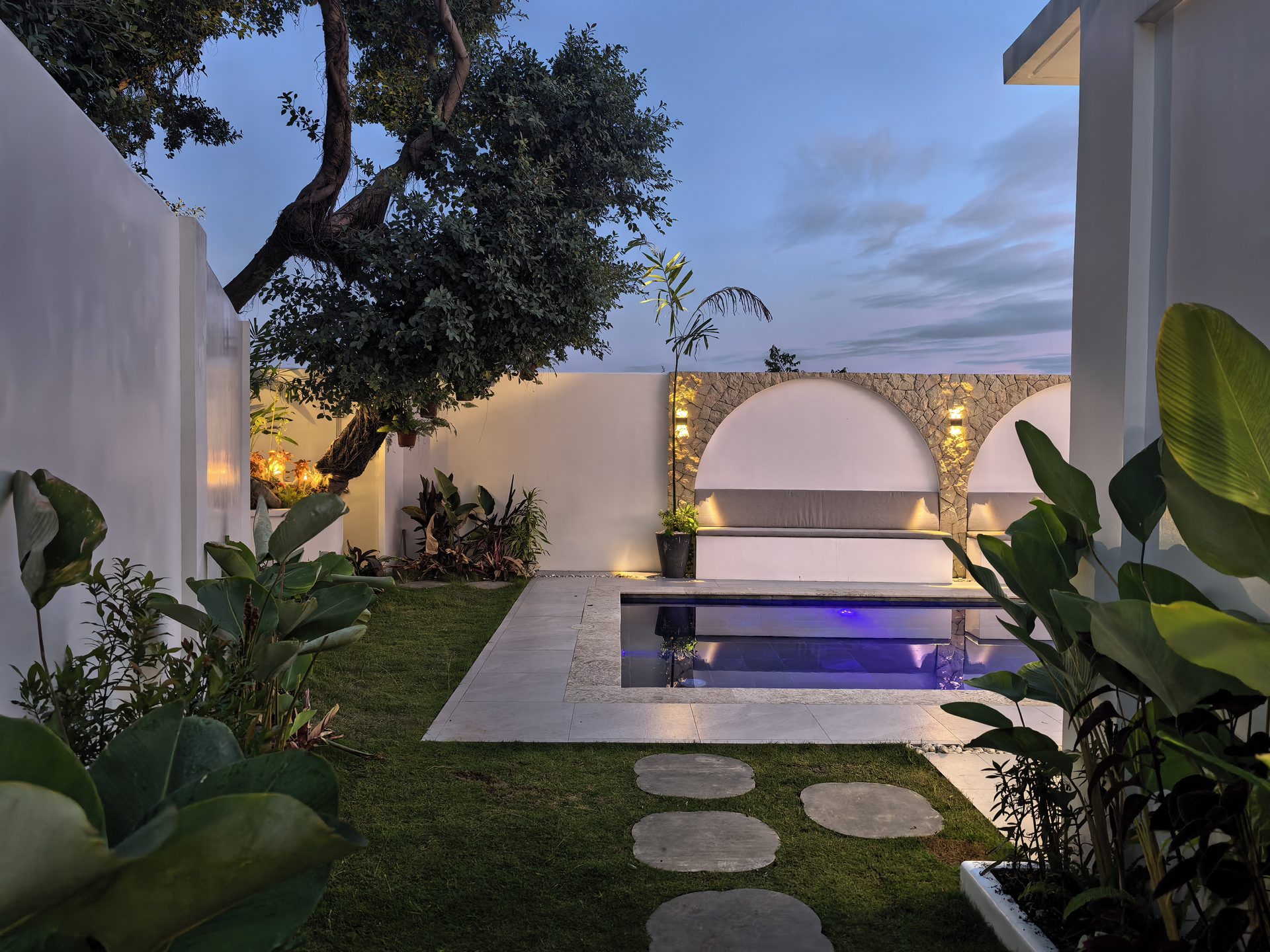 Evening garden with lit pathway